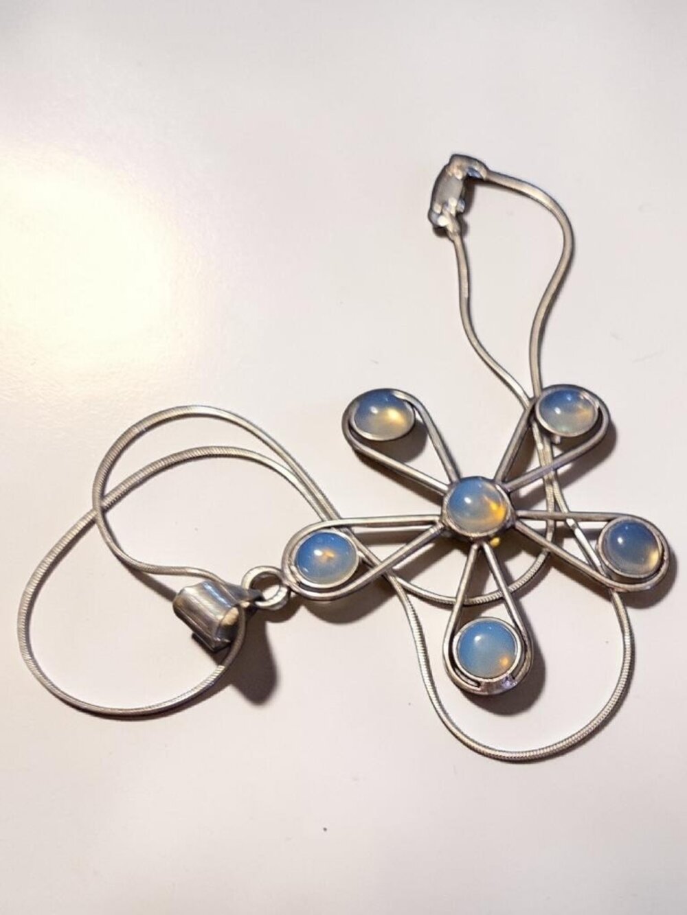 An 18" SS Chain Holding Six Opalites on A Pendant Measuring 2 1/2" x 2"